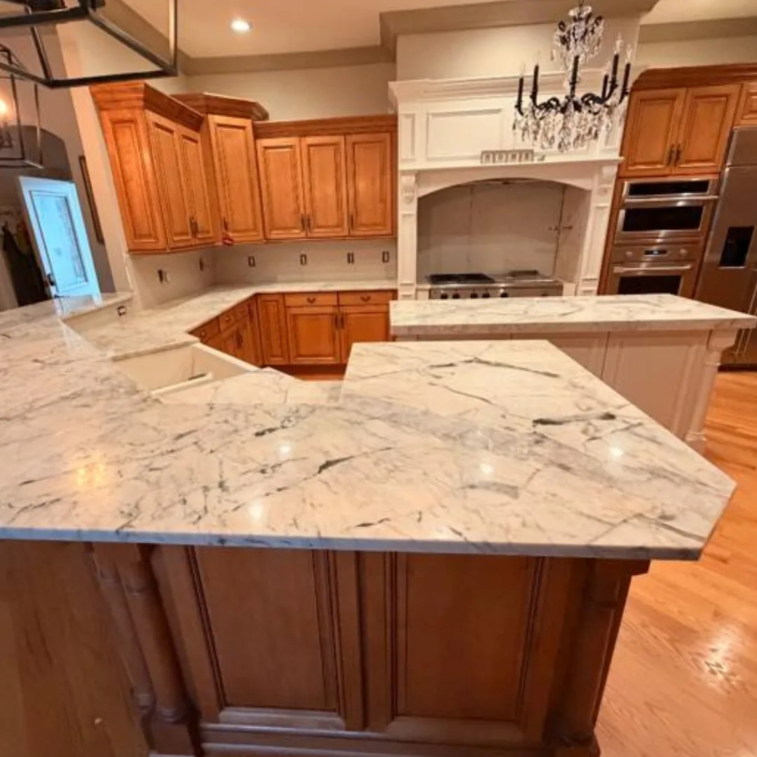 Beautiful white marble countertops in a spacious kitchen