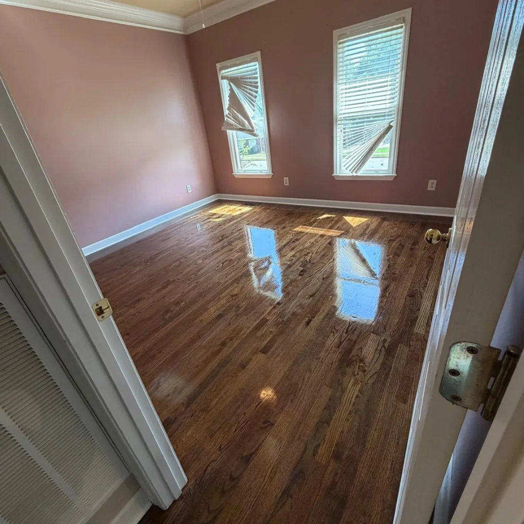 Shiny hardwood floor in empty room
