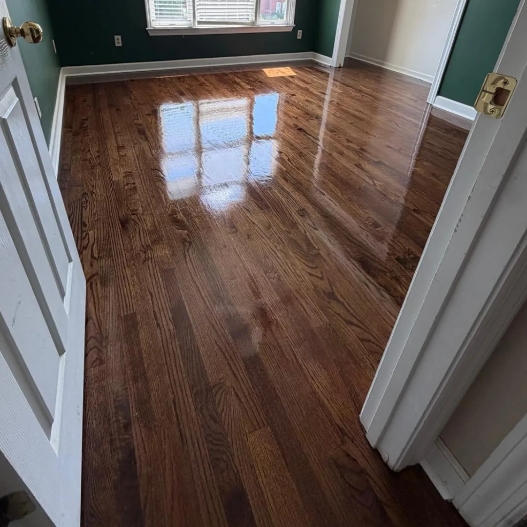 Newly refinished hardwood floors in a room.