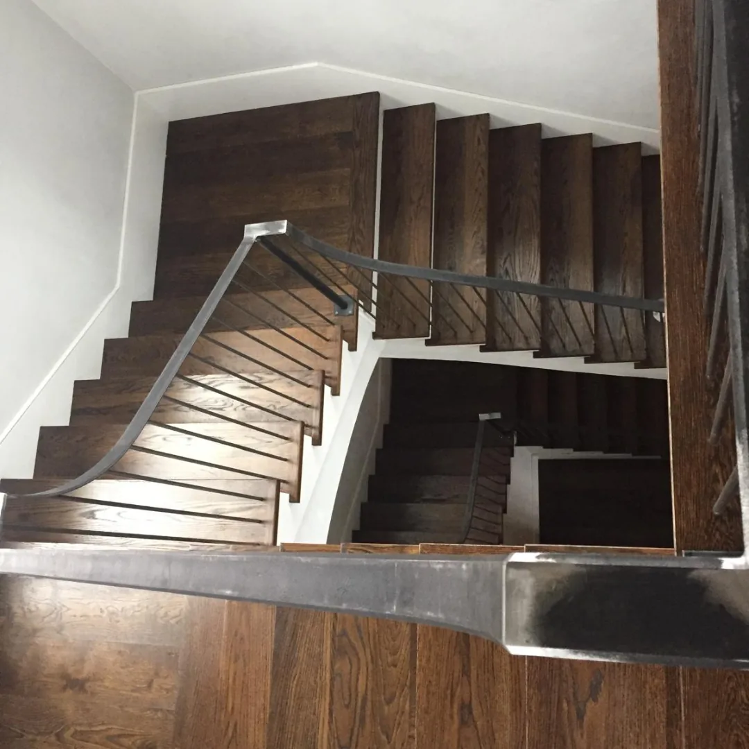 Modern wood staircase with metal railings