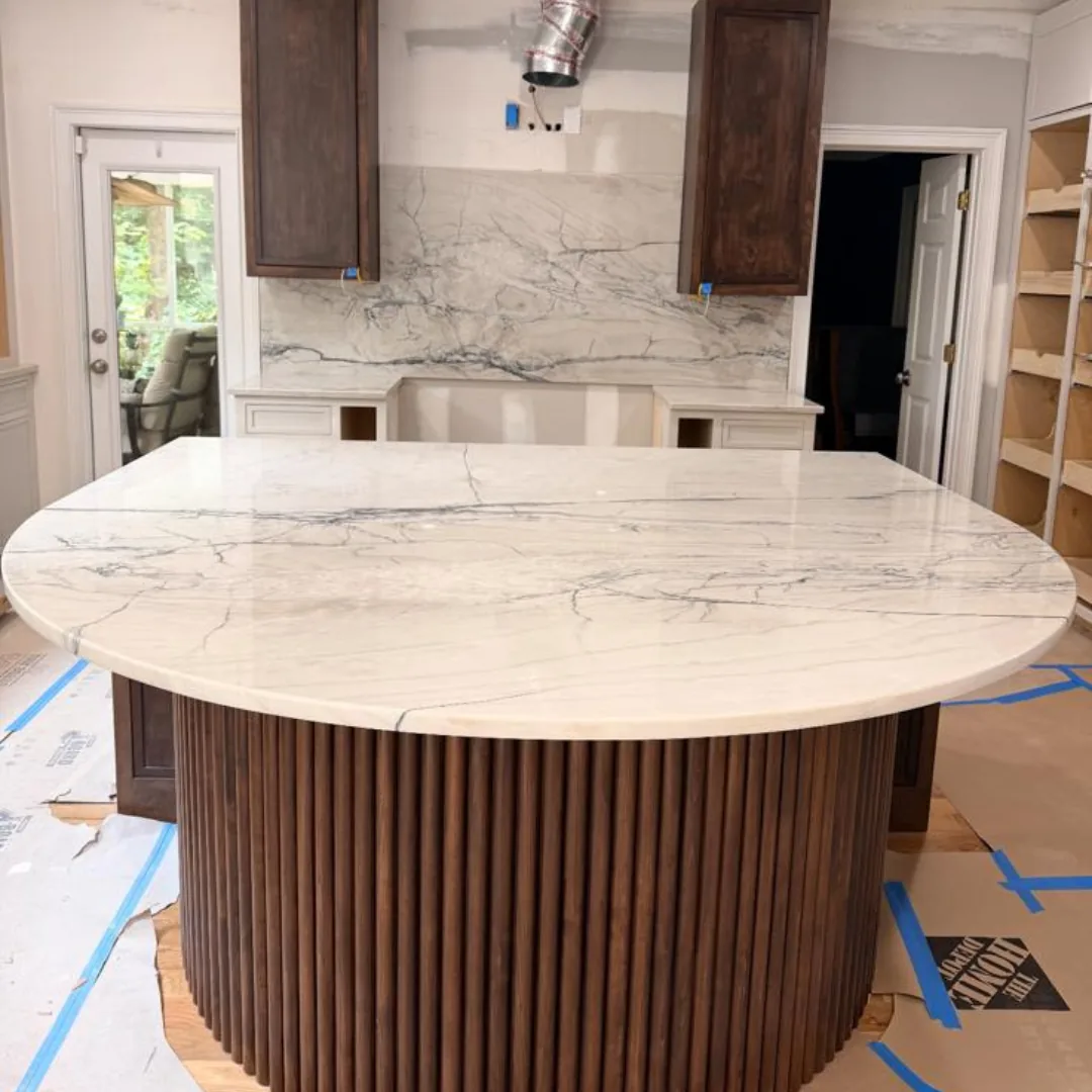 Kitchen island and counters with beautiful marble finish.