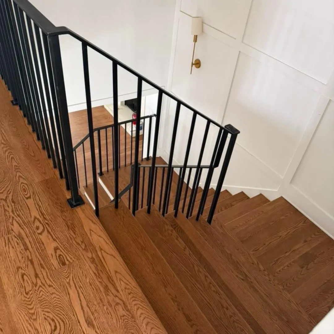 Stairs with wood treads and black railing